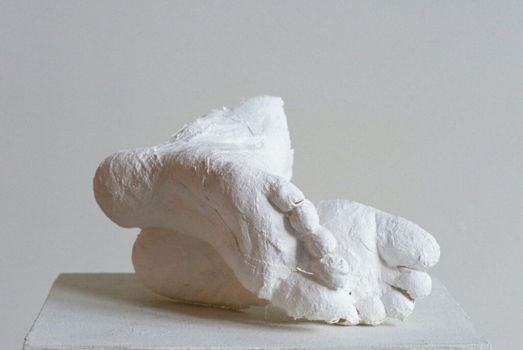 Plaster casting of feet on a pedestal
