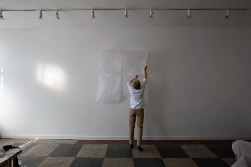 Image of artist in front of Ghost piece